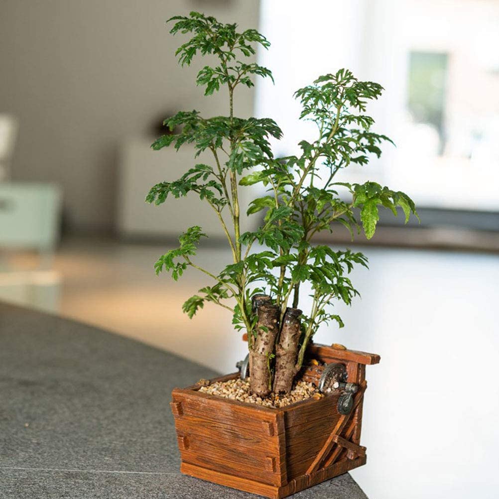 Mini maceta con forma de máquina